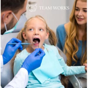 Girl at the dentist with her mother